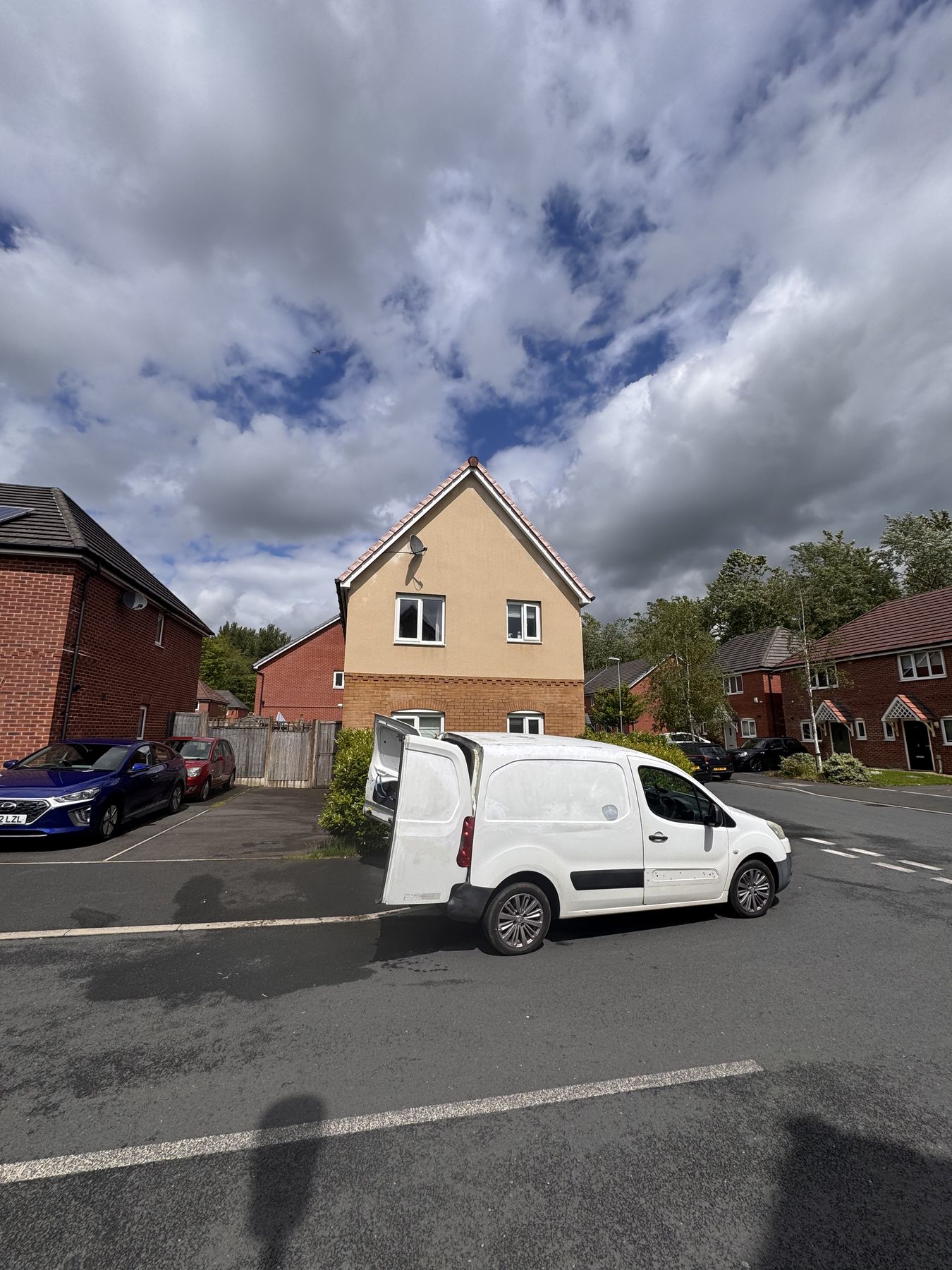 Detached house render after softwash — clean warm render restored