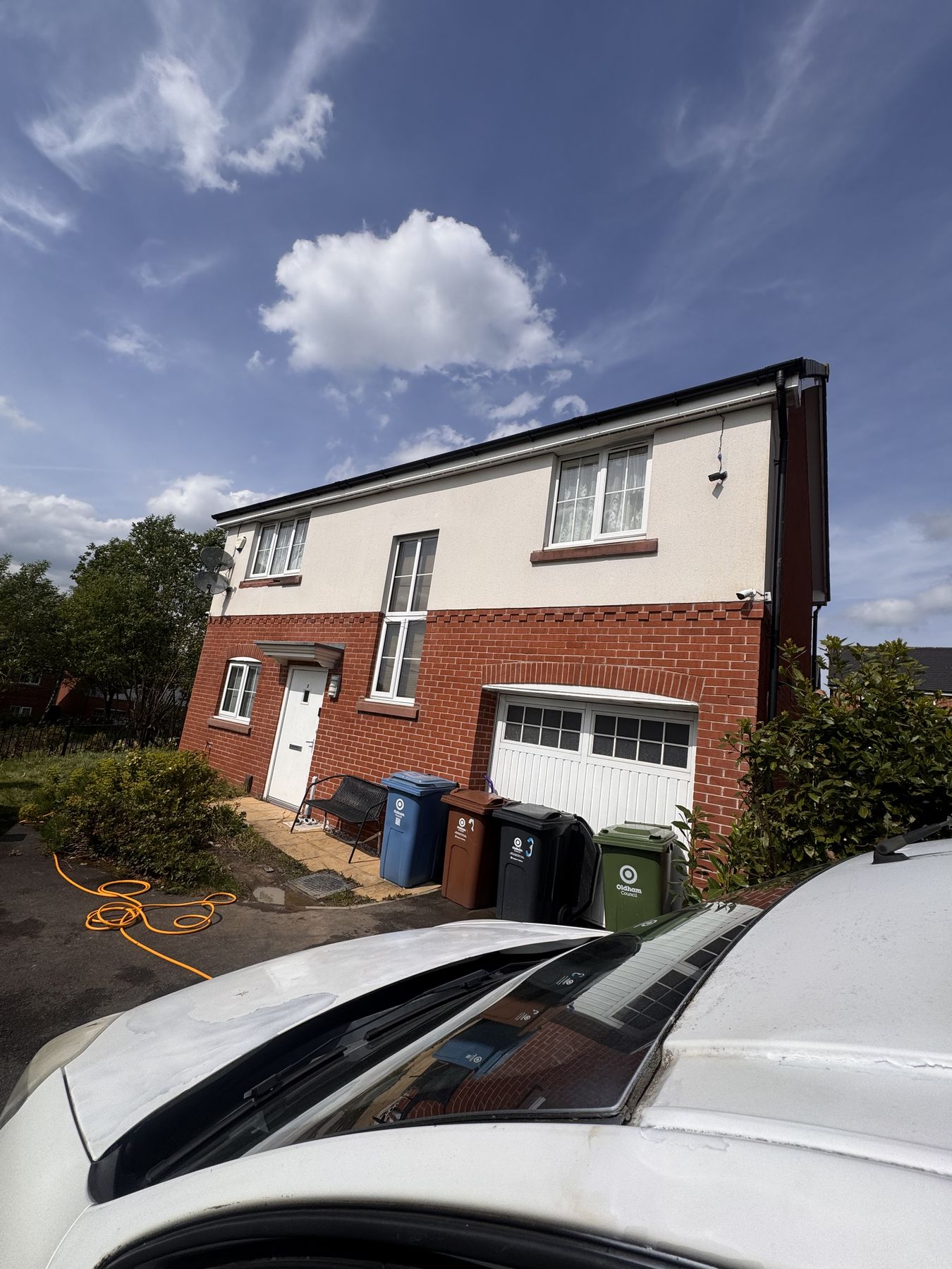 Render cleaned property in Oldham — clean white render after softwashing